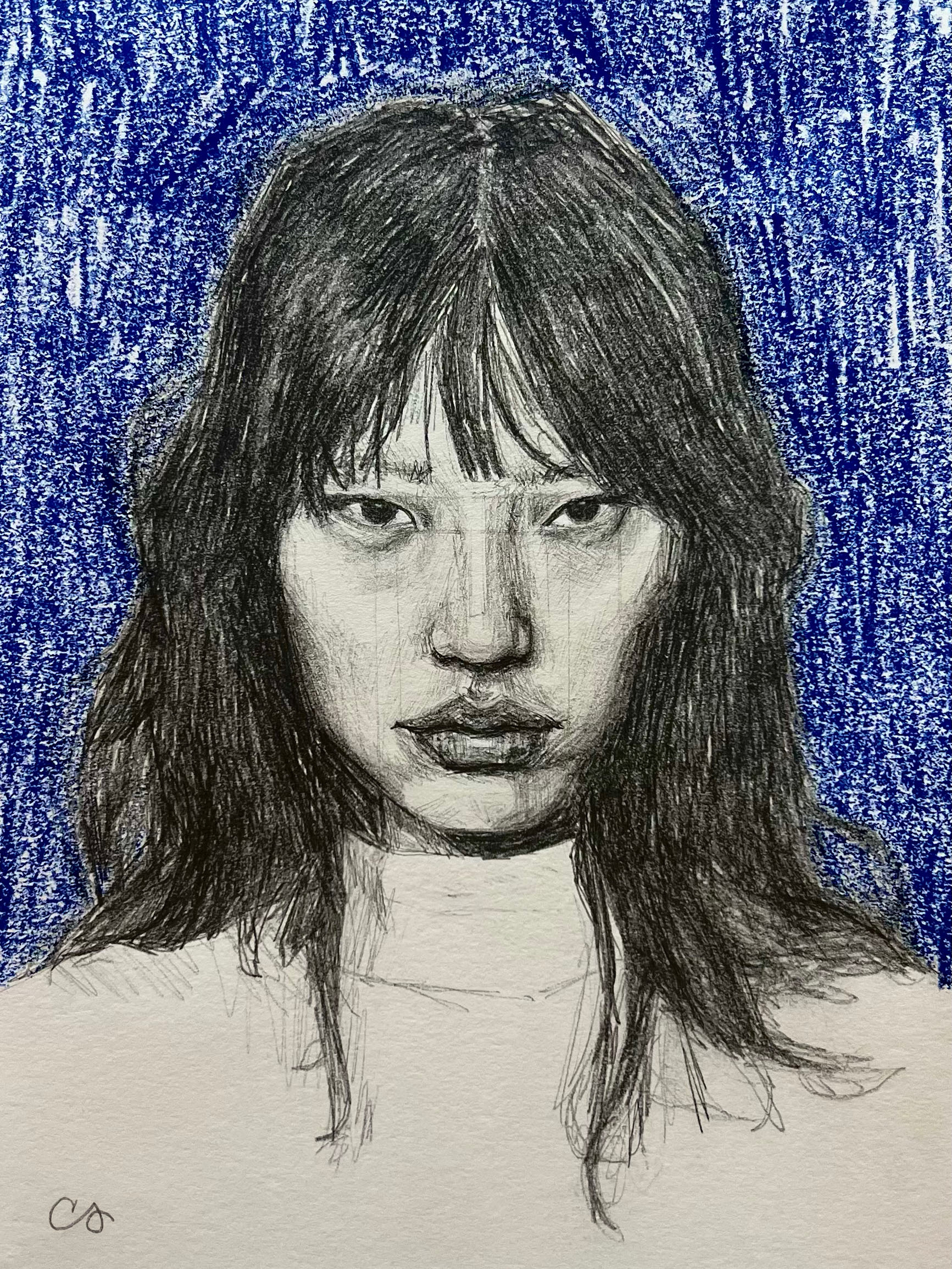A graphite portrait of a woman with long dark hair and bangs against a cobalt blue crayon background